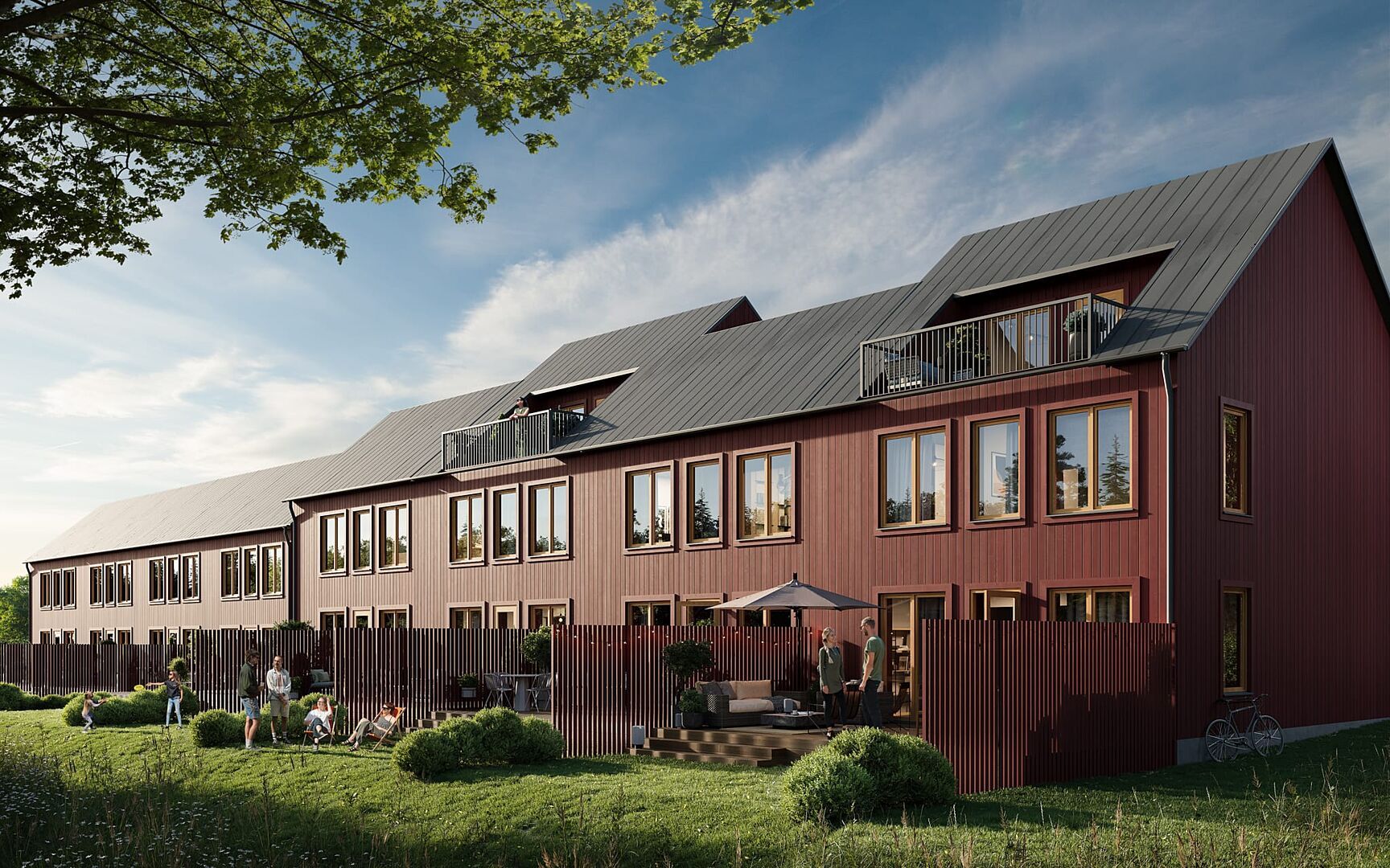 Inflyttningsklar lägenhet i rött flerbostadshus med uteplats och grönyta